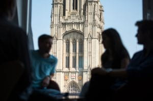 people talking with Wills Memorial building in background