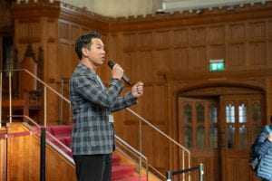 Jay Liu, President of the Fintech Society, addressing the audience at a Welcome Week event.